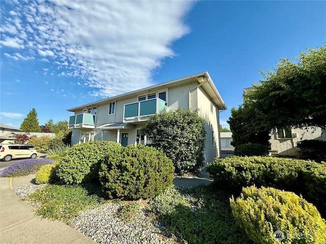 155 Lavender Ct Unit 47, Wenatchee, WA 98801 - view of front facade with stucco siding and a balcony