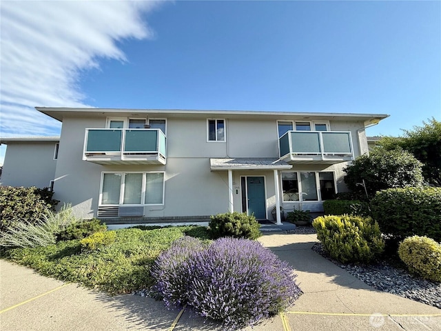 155 Lavender Ct Unit 47, Wenatchee, WA 98801 - view of front of house featuring a balcony and stucco siding