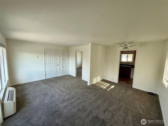 155 Lavender Ct Unit 47, Wenatchee, WA 98801 - spare room with dark carpet, baseboards, and a ceiling fan