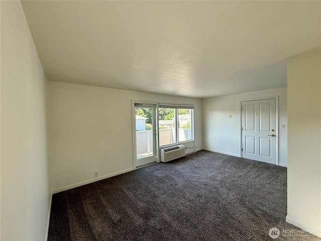 155 Lavender Ct Unit 47, Wenatchee, WA 98801 - empty room featuring dark colored carpet, baseboards, and a wall mounted AC