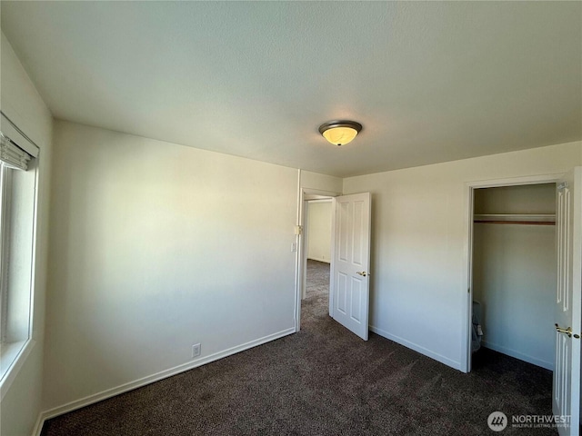 155 Lavender Ct Unit 47, Wenatchee, WA 98801 - unfurnished bedroom with dark carpet and baseboards