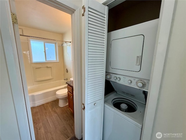 155 Lavender Ct Unit 47, Wenatchee, WA 98801 - laundry area with estacked washer and dryer and wood finished floors