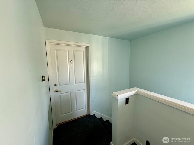 155 Lavender Ct Unit 47, Wenatchee, WA 98801 - staircase featuring a textured ceiling and baseboards