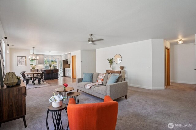 29664 127th Pl SE, Auburn, WA 98092 - living area with light colored carpet, a chandelier, and a ceiling fan