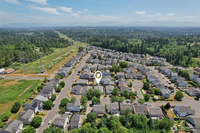 29664 127th Pl SE, Auburn, WA 98092 - aerial perspective of suburban area with a forest and a mountainous background