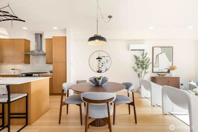 5175 42nd Ave S, Seattle, WA 98118 - dining space featuring a wall unit AC, light wood-style floors, and recessed lighting