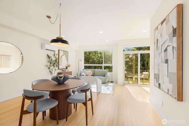 5175 42nd Ave S, Seattle, WA 98118 - dining space with an AC wall unit, light wood finished floors, and recessed lighting