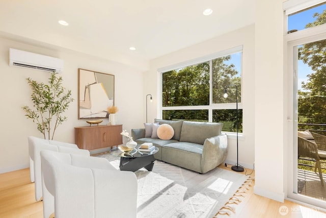 5175 42nd Ave S, Seattle, WA 98118 - living room featuring a wall unit AC, plenty of natural light, light wood-type flooring, and recessed lighting