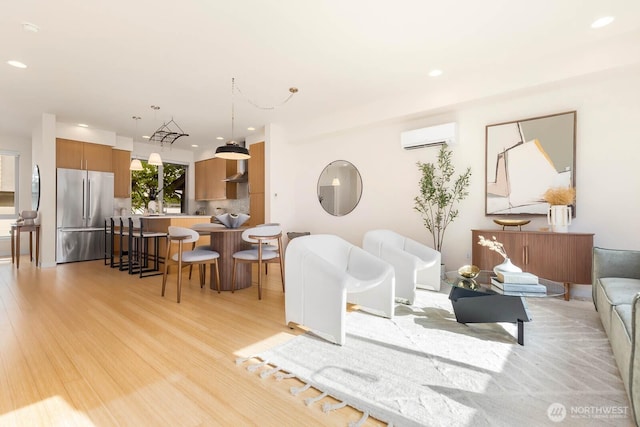 5175 42nd Ave S, Seattle, WA 98118 - living room with an AC wall unit, recessed lighting, and light wood-type flooring