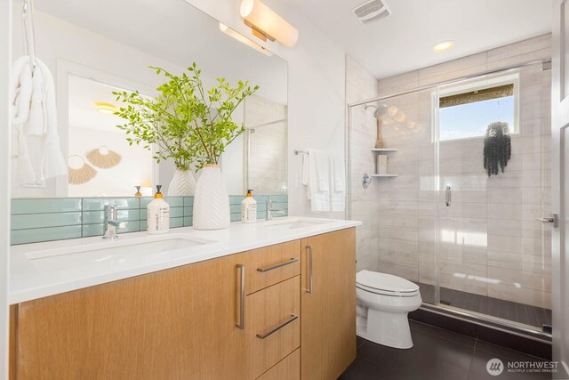 5175 42nd Ave S, Seattle, WA 98118 - bathroom featuring double vanity, a stall shower, and tile patterned flooring