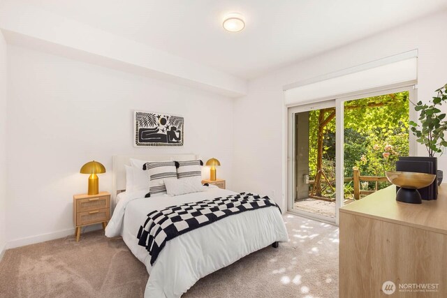 5175 42nd Ave S, Seattle, WA 98118 - carpeted bedroom featuring access to outside and baseboards