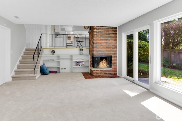 12427 NE 141st Way, Kirkland, WA 98034 - unfurnished living room featuring carpet, stairs, and a fireplace