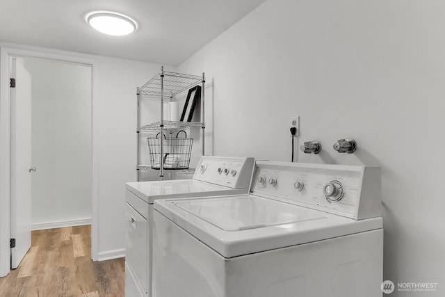 12427 NE 141st Way, Kirkland, WA 98034 - laundry area with washing machine and clothes dryer and light wood-style floors