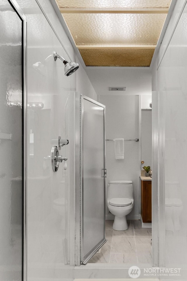 12427 NE 141st Way, Kirkland, WA 98034 - bathroom featuring a shower stall, marble finish floors, and vanity