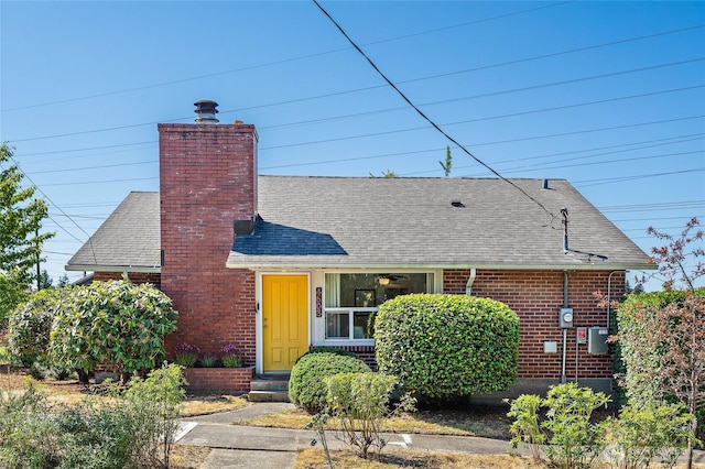 4603 15th Ave S, Seattle, WA 98108 - view of front of home featuring a shingled roof, a chimney, and brick siding