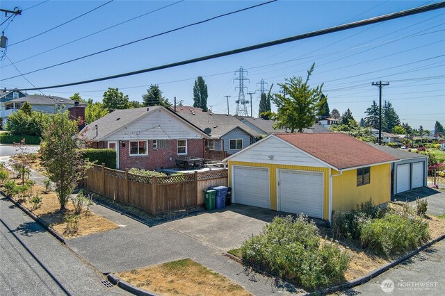 4603 15th Ave S, Seattle, WA 98108 - view of front facade featuring a garage and an outdoor structure