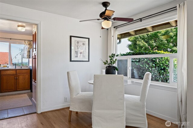 4603 15th Ave S, Seattle, WA 98108 - dining space with light wood-type flooring, ceiling fan, and healthy amount of natural light