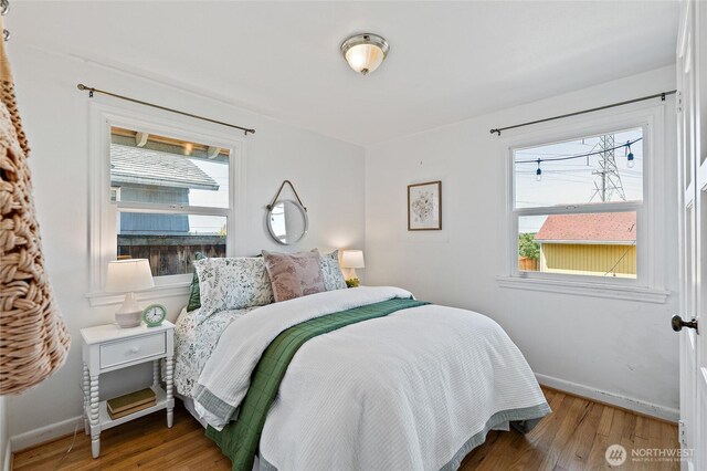 4603 15th Ave S, Seattle, WA 98108 - bedroom with multiple windows and wood finished floors
