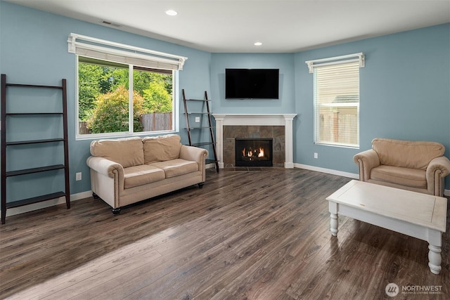 15527 E 82nd Ave E, Puyallup, WA 98375 - living room with wood finished floors, a tiled fireplace, and recessed lighting