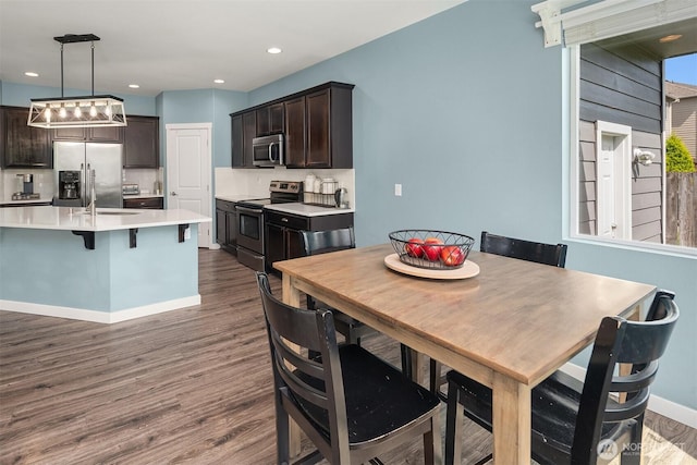15527 E 82nd Ave E, Puyallup, WA 98375 - dining area featuring dark wood-style floors and recessed lighting