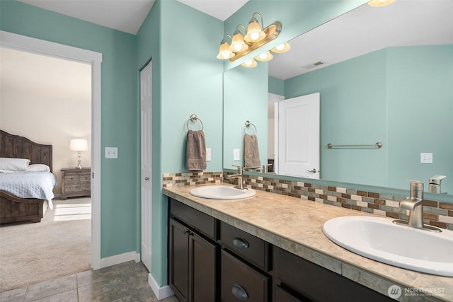 15527 E 82nd Ave E, Puyallup, WA 98375 - bathroom featuring double vanity, backsplash, ensuite bath, and tile patterned floors