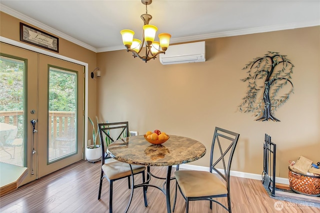 221 S Prairie Carbon River Rd E, South Prairie, WA 98385 - dining space featuring a wall mounted air conditioner, a chandelier, light wood finished floors, and crown molding