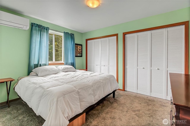 221 S Prairie Carbon River Rd E, South Prairie, WA 98385 - bedroom featuring a wall mounted AC, carpet, and multiple closets