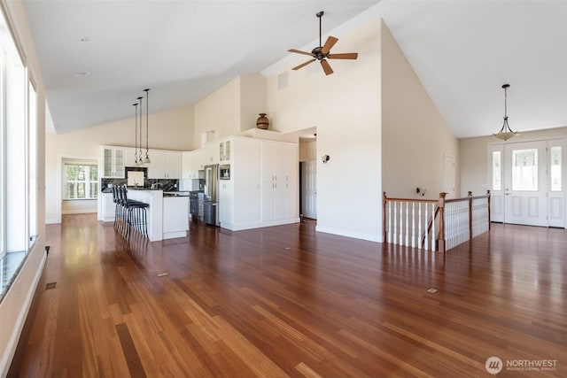 42811 Newaukum Valley Rd, Chehalis, WA 98532 - unfurnished living room with high vaulted ceiling, dark wood-style flooring, and ceiling fan