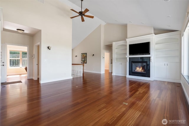 42811 Newaukum Valley Rd, Chehalis, WA 98532 - unfurnished living room featuring high vaulted ceiling, a ceiling fan, a fireplace, and wood finished floors