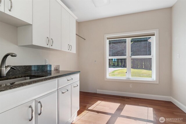 42811 Newaukum Valley Rd, Chehalis, WA 98532 - kitchen featuring light wood finished floors, healthy amount of natural light, and white cabinetry
