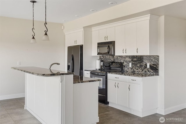 42811 Newaukum Valley Rd, Chehalis, WA 98532 - kitchen featuring black appliances, tasteful backsplash, an island with sink, and white cabinetry