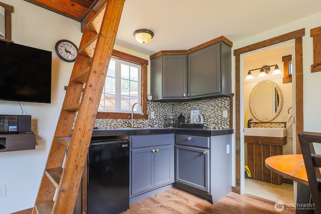 180 Country River Ln, Entiat, WA 98822 - kitchen featuring freestanding refrigerator, backsplash, gray cabinetry, and light wood finished floors