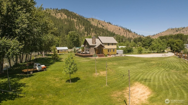 180 Country River Ln, Entiat, WA 98822 - view of grassy yard with a deck with mountain view