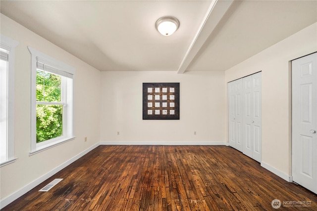 2502 218th St E, Spanaway, WA 98387 - unfurnished bedroom featuring dark wood-type flooring and baseboards