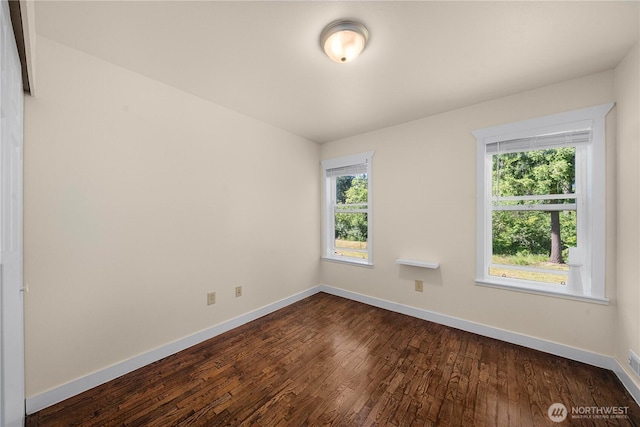 2502 218th St E, Spanaway, WA 98387 - unfurnished room featuring healthy amount of natural light and dark wood-type flooring