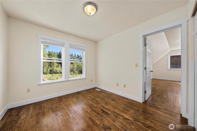 2502 218th St E, Spanaway, WA 98387 - unfurnished room with dark wood-style flooring and lofted ceiling