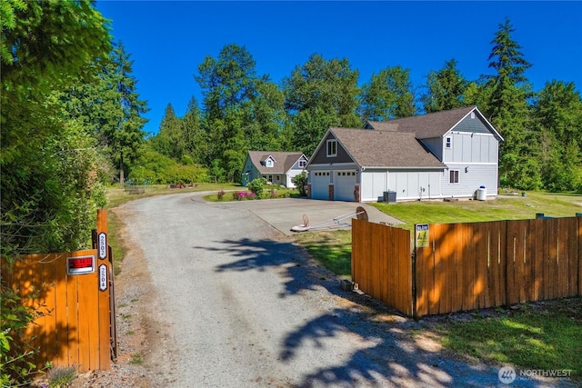 2502 218th St E, Spanaway, WA 98387 - view of dirt / gravel driveway with a gate