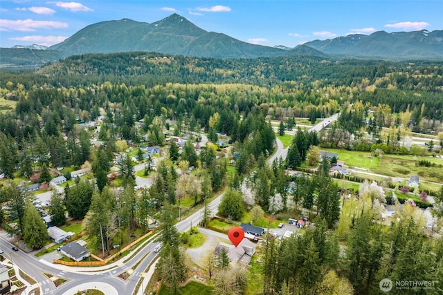 13617 436th Ave SE, North Bend, WA 98045 - aerial view of property and surrounding area featuring mountains and a heavily wooded area