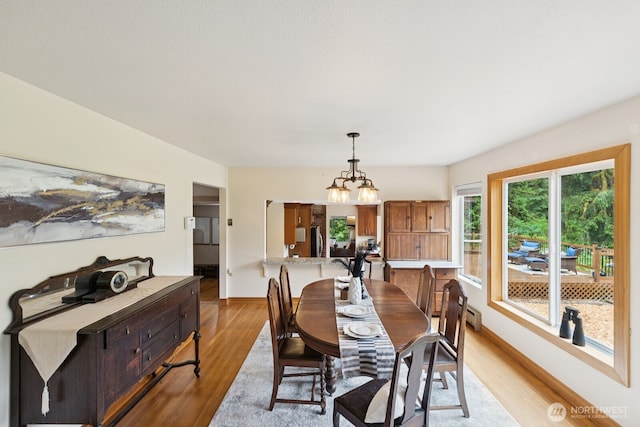 45908 SE Edgewick Rd, North Bend, WA 98045 - dining room featuring light wood-style floors and a chandelier