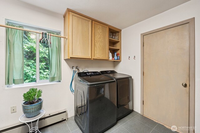 45908 SE Edgewick Rd, North Bend, WA 98045 - washroom with a baseboard heating unit, washer and clothes dryer, and cabinet space