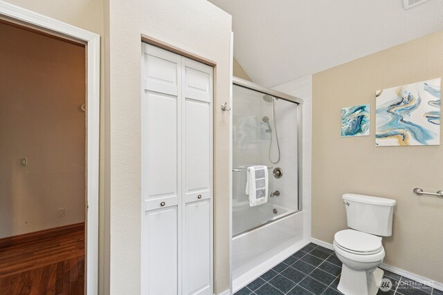 45908 SE Edgewick Rd, North Bend, WA 98045 - full bath with vaulted ceiling, bath / shower combo with glass door, a closet, and tile patterned floors