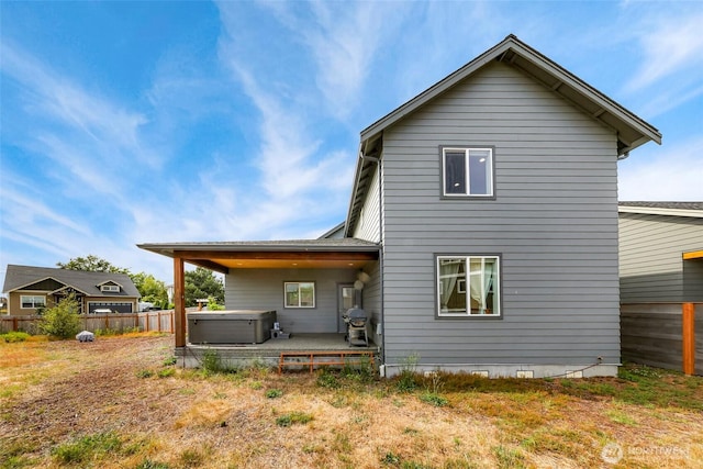 4123 Stuart Cir, Ferndale, WA 98248 - rear view of house featuring a hot tub and a patio area