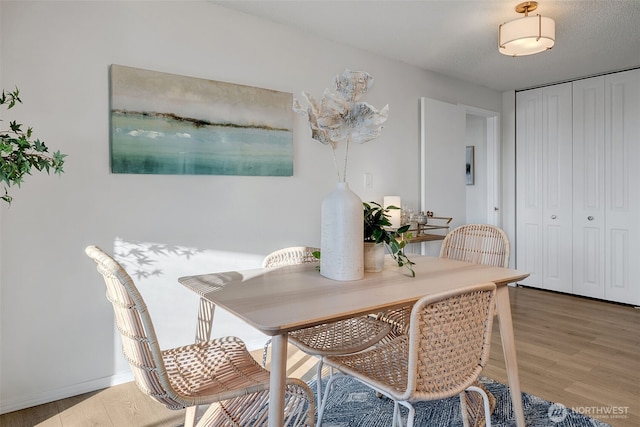9500 Rainier Ave S Unit 303, Seattle, WA 98118 - dining room with light wood-style flooring