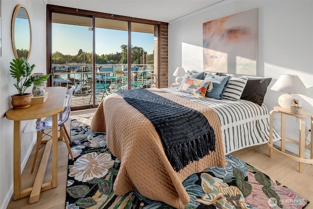 9500 Rainier Ave S Unit 303, Seattle, WA 98118 - bedroom featuring access to outside and wood finished floors