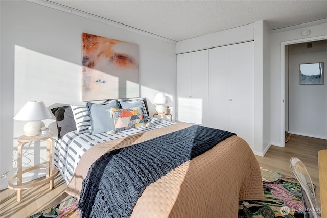 9500 Rainier Ave S Unit 303, Seattle, WA 98118 - bedroom featuring wood finished floors and a closet
