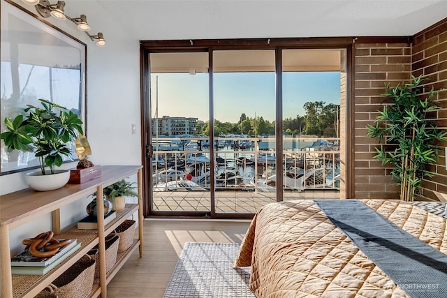 9500 Rainier Ave S Unit 303, Seattle, WA 98118 - bedroom with wood finished floors and access to outside