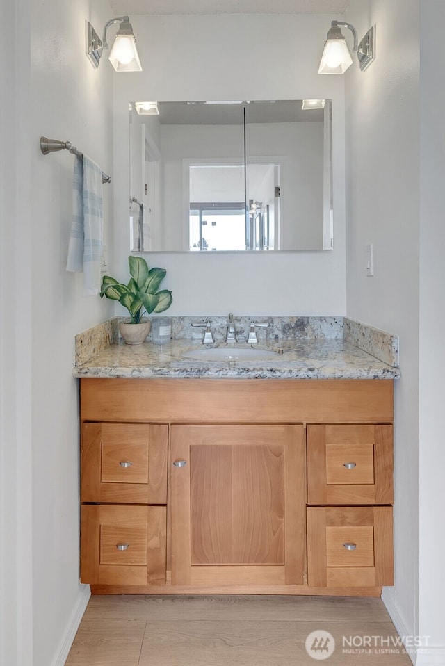 9500 Rainier Ave S Unit 303, Seattle, WA 98118 - bathroom featuring vanity and baseboards