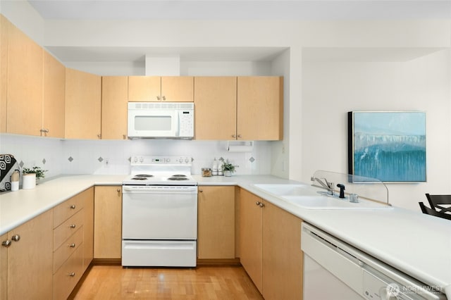 2840 139th Ave SE Unit 9, Bellevue, WA 98005 - kitchen with white appliances, light brown cabinetry, light wood finished floors, light countertops, and backsplash