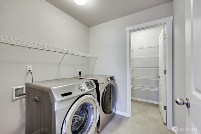 4236 SW Colbert Way, Port Orchard, WA 98367 - washroom with washer and clothes dryer, baseboards, and light tile patterned floors