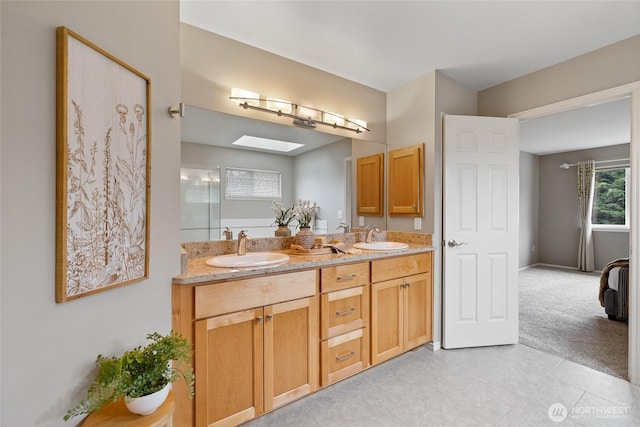 11318 34th Dr SE, Everett, WA 98208 - bathroom featuring double vanity, a skylight, and tile patterned floors